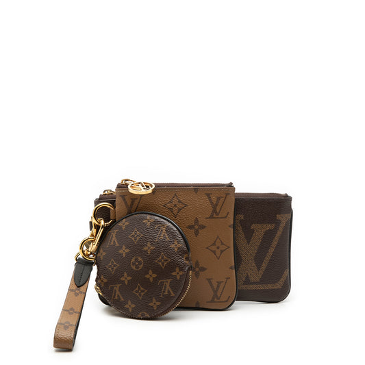 Louis Vuitton Monogram Reverse Giant Trio Pouch Set showing three elegant SLG pouches with signature monogram pattern and leather accents.