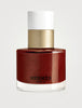 Hermès Les Mains Hermès Brun Helios nail polish bottle with black cap, showcasing elegant packaging and color details.