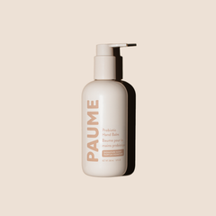 PAUME Probiotic Hand Balm in a jar, featuring smooth cream texture for nourishing and soothing dry hands.