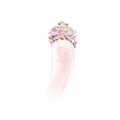 Swatch of Clé de Peau Beauté Luminizing Face Enhancer in various shades, highlighting its luminous, iridescent finish.