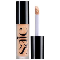 Saie Slip Tint Radiant All-Over Concealer in multiple shades, featuring a sleek tube and applicator for natural-looking coverage.