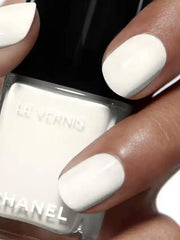 Chanel Vernis Nail Colour bottles in various shades, displaying shiny, colorful nail polish for beauty and manicure purposes.