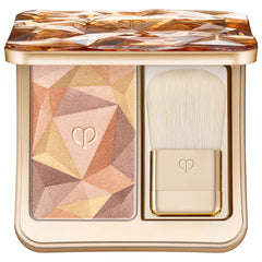 Clé de Peau Beauté Luminizing Face Enhancer in various shades, close-up of the brand's luxury beauty product with shimmering finish.