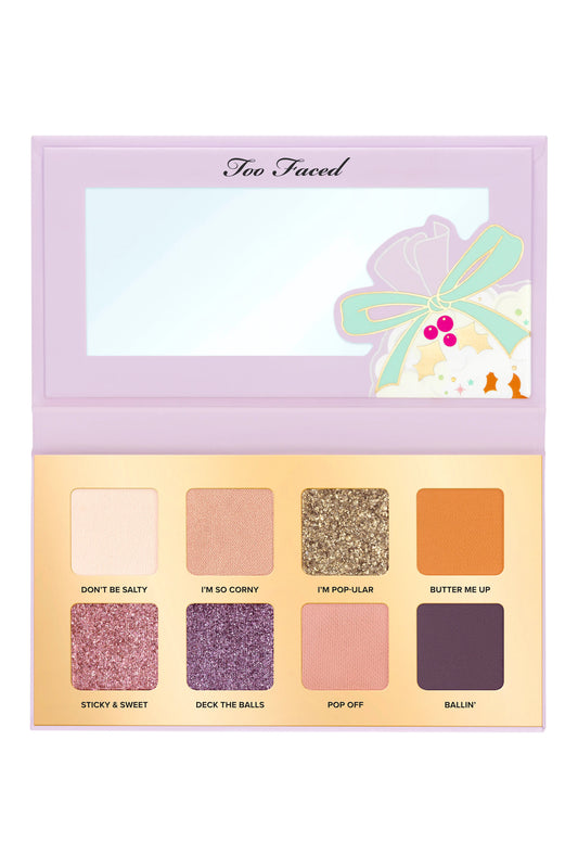Too Faced Popcorn Balls eye shadow palette with warm-toned shades and popcorn-inspired packaging.