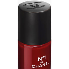 Chanel N°1 de Chanel Revitalizing Eye Serum in 15ml bottle, shown with sleek packaging and applicator for youthful eye care.