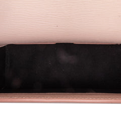 Pink Tom Ford calfskin lock crossbody bag with sleek design and adjustable strap, showcasing luxury fashion accessories.