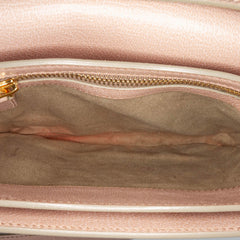 Tom Ford Medium Leather Natalia Crossbody Bag in pink, featuring sleek design and adjustable strap, on a white background.