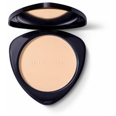Dr. Hauschka compact powder in shade 00, displayed in a sleek round compact with a mirror, suitable for natural makeup looks.