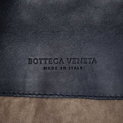 Black Bottega Veneta Mini Nappa Intrecciato turn lock crossbody bag with woven leather design and compact style.