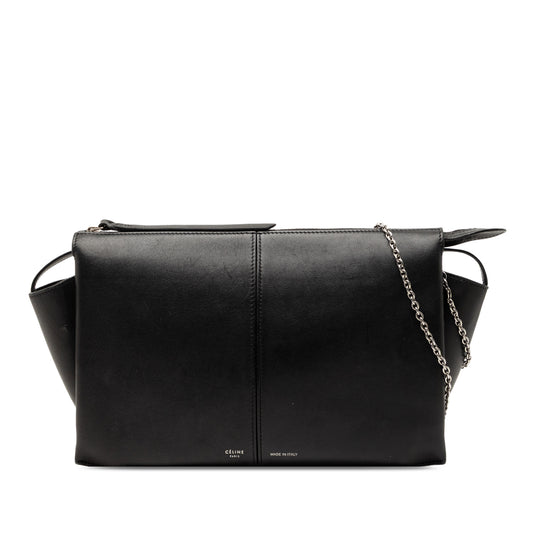 Black Celine Trifold leather clutch bag with chain strap, featuring sleek design and compact size for elegant carry.