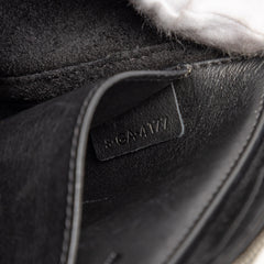 Black Celine trifold leather clutch bag with chain strap, stylish and compact for elegant carry.
