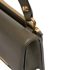 Alexander McQueen mini leather bag with skull lock detail in green, featuring top handle and compact design.