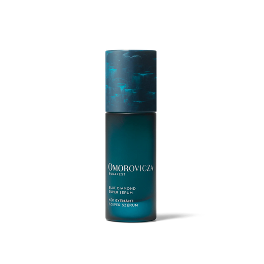 Omorovicza Blue Diamond Super Serum in 30ml bottle, featuring a sleek blue packaging and applicator for radiant skin.