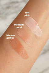 Swatches of Chanel No.1 De Chanel Skin Enhancer Intense Amber in 30ml bottle, showcasing its shade and creamy texture.