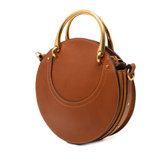 Chloé small suede and raffia Pixie satchel bag with top handle and woven accents, showcasing elegant craftsmanship.