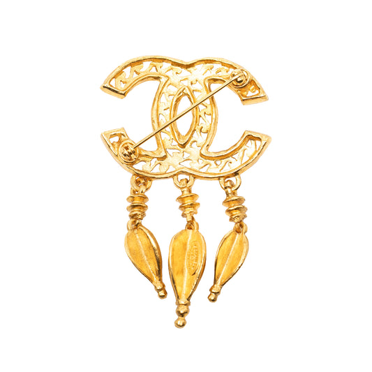 Chanel CC gold plated filigree pin brooch featuring intricate jewelry detailing and a polished finish.