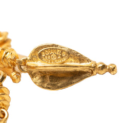 Chanel CC gold plated filigree pin brooch with intricate design, showcasing elegant jewelry craftsmanship.