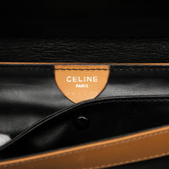 Black Celine leather carriage clutch bag with sleek design and gold-tone hardware, perfect for elegant occasions.