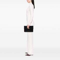 Black Celine leather carriage clutch bag with sleek design and subtle branding, perfect for elegant occasions.