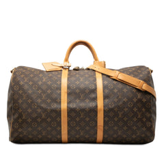Louis Vuitton Monogram Keepall Bandouliere 60 bag in brown canvas with leather trim and silver hardware.