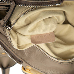 Chloé Medium Leather Paddington handbag in tan with top handles, gold hardware, and signature lock detail.