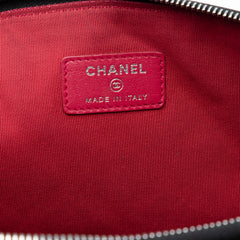 Pre-owned Chanel large aged calfskin Gabrielle O case clutch in black with gold-tone hardware and textured finish.