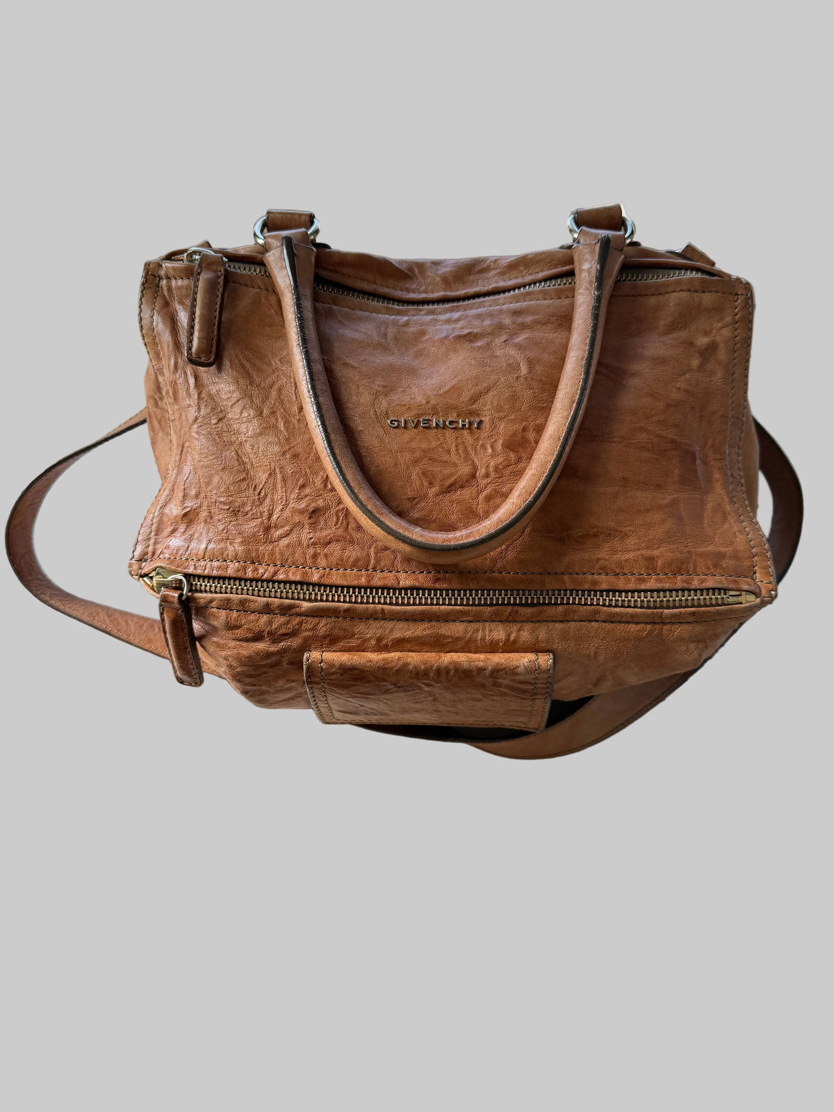 Givenchy large Pepe Tan Pandora bag with textured leather and gold-tone hardware, featuring top handles and a spacious interior.