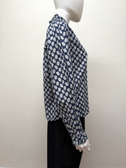 The Great Cotton Daisy Blouse featuring a light, breathable fabric with a floral daisy pattern and a relaxed fit.