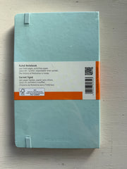 Moleskine Classic hardcover ruled notebook with black cover and elastic closure, designed for note-taking and writing.