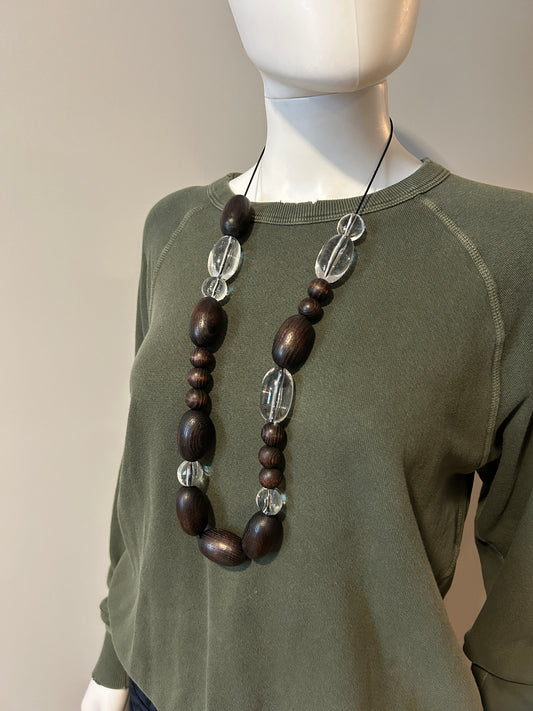 A.P.C. bead necklace featuring colorful round beads and a silver clasp, displayed on a neutral background.