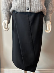 Black Acne asymmetrical hoist skirt in size 38/6, featuring a modern, edgy design with uneven hem and tailored fit.