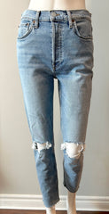 Re/Done 90s high-rise ankle crop jeans in size 28, showing light wash denim with distressed hem and classic five-pocket design.
