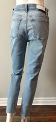 Re/Done 90s high-rise ankle crop jeans in size 28, showing light wash denim and classic five-pocket design.
