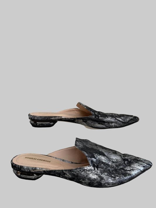 Silver Nicholas Kirkwood flat mule shoes, size 38, with sleek design and pointed toe, displayed on neutral background.