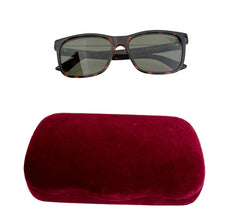 Gucci GG0746S 001 sunglasses with black frames and dark lenses, stylish accessory for eye protection and fashion.