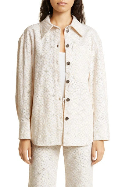 BAUM UND PFERDGARTEN Mahina organic cotton eyelet shirt jacket displayed on a hanger, featuring intricate eyelet detailing and lightweight fabric.