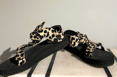 Loeffler Randall animal print sandals in size 7.5, featuring stylish open-toe design and bold patterned straps.