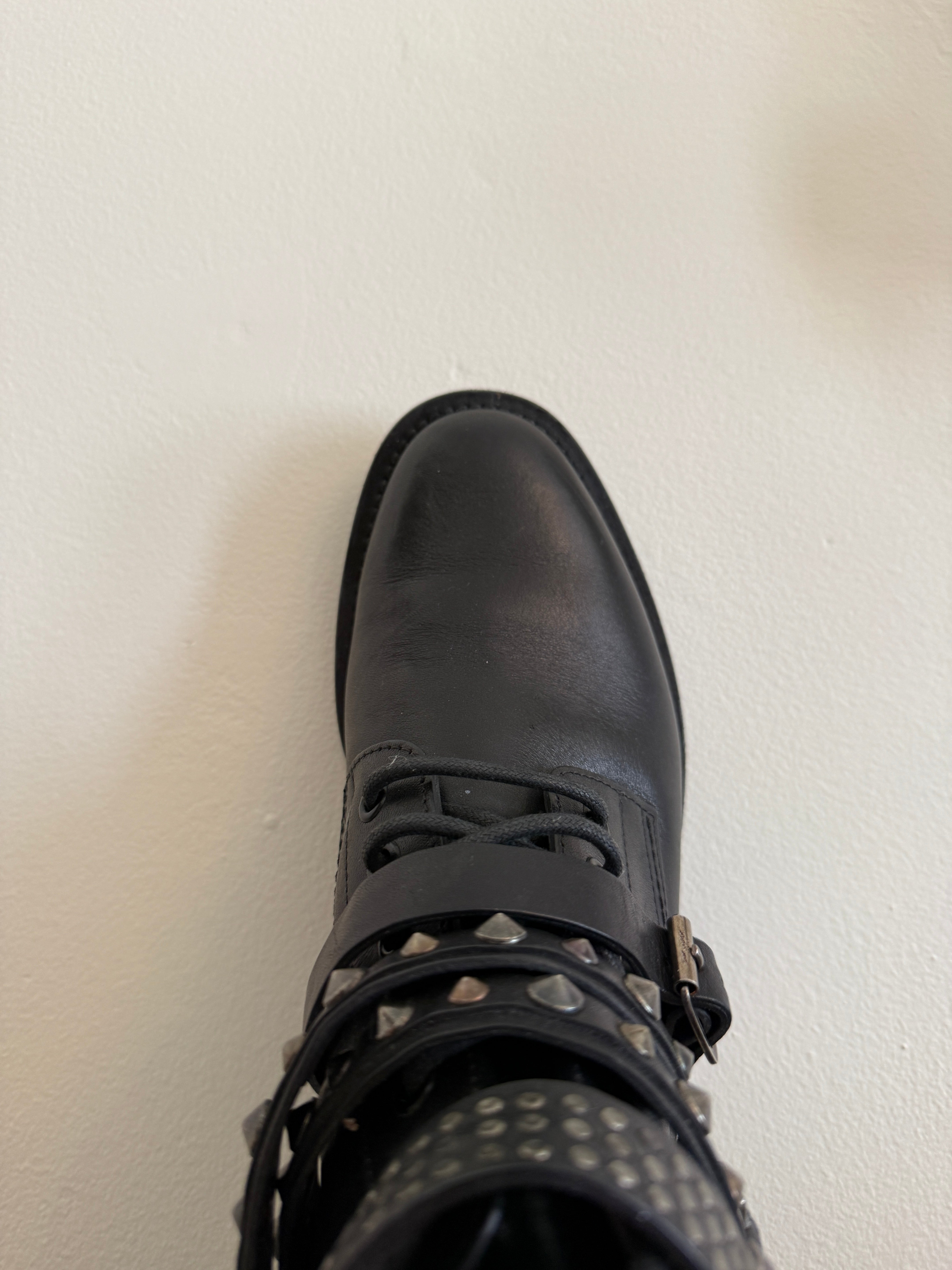 Yves Saint Laurent Ranger Stud Boot with wrap straps in size 37.5, featuring black leather and metal stud details.