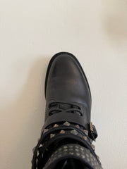 Yves Saint Laurent Ranger Stud Boot with wrap straps in size 37.5, featuring black leather and metal stud details.