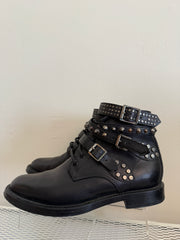 Yves Saint Laurent Ranger stud boots with wrap straps in size 37.5, featuring black leather and silver stud details.