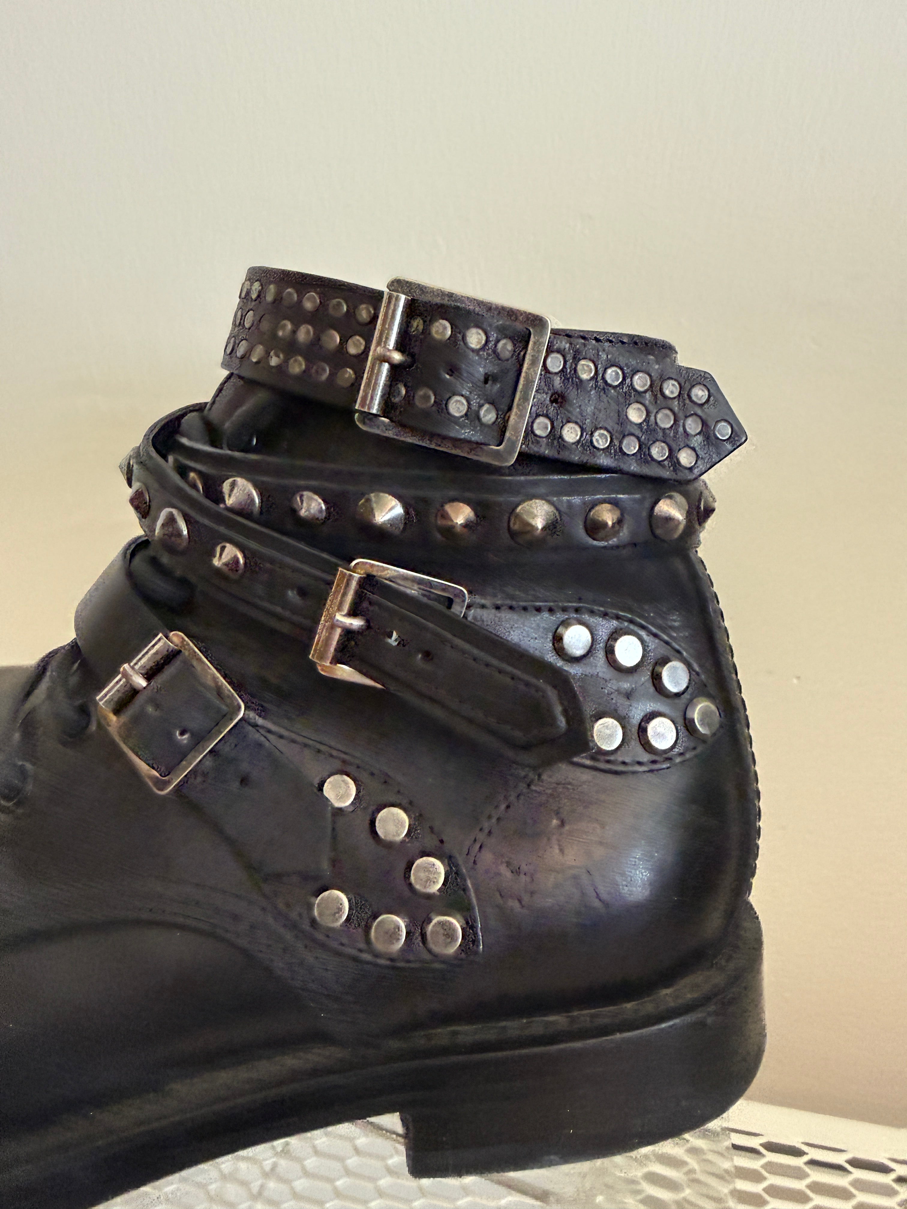 Yves Saint Laurent Ranger stud boots in size 37.5 with wrap straps, black leather ankle boots with stud details.