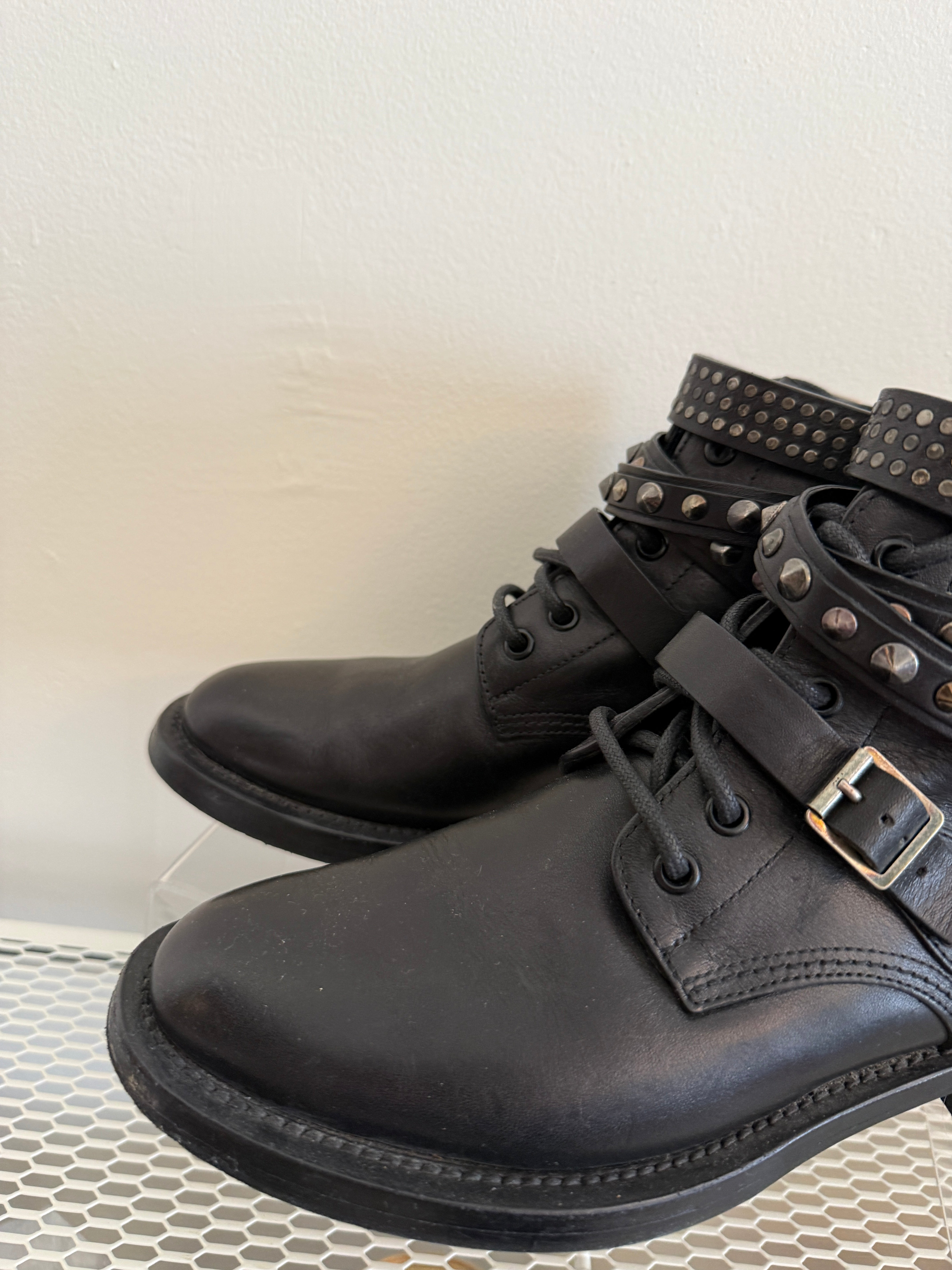 Yves Saint Laurent Ranger Stud Boot in size 37.5 with wrap straps, featuring stud details and sleek black leather design.