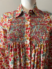 Loretta Caponi floral blouse in size small, featuring a delicate floral pattern and elegant fabric, perfect for stylish casual wear.