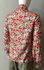 Loretta Caponi floral blouse in size small, featuring delicate floral print and lightweight fabric, displayed on a hanger.