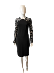 Stella McCartney mini dress in size IT44/US6, stylishly designed, displayed on a hanger with elegant fabric details.