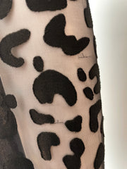 Stella McCartney mini dress in size IT44/US6, featuring a stylish and elegant design, displayed on a hanger.