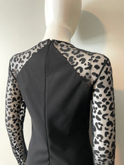 Stella McCartney mini dress in size IT44/US6, stylish black clothing with elegant design, shown on a model.