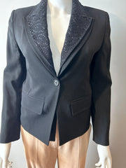 Ann Demeulemeester black two-way blazer size 34/2, tailored fit, with structured lapels and sleek design, displayed on a hanger.