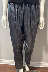 Suzie Kondi Gunmetal Shine Pants in size M/L, stylish metallic clothing with a shiny gunmetal finish, shown on a model.