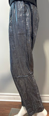 Suzie Kondi gunmetal shine pants in size M/L, stylish metallic clothing with a sleek, shiny finish, displayed on a hanger.